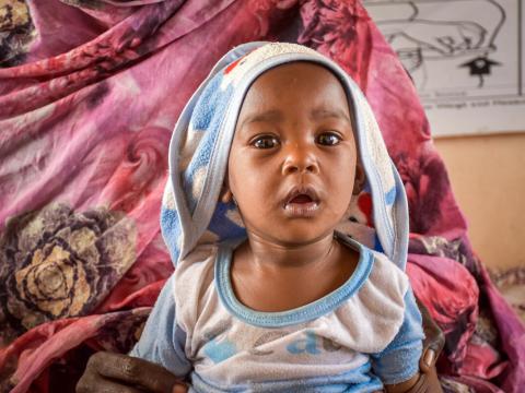 7-month-old Tagwa, seen here at a World Vision operated Stabilisation Centre, with mother, Isha Mohamed.
