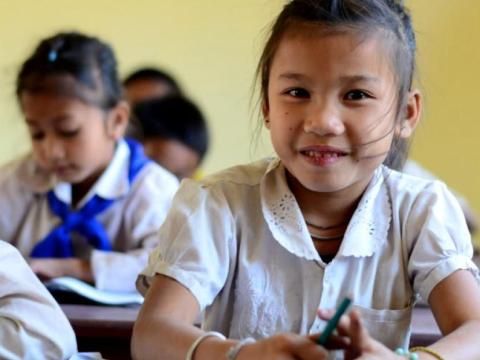 Young girl learning at a school